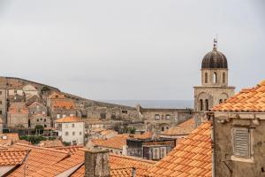 a view of a city with a church and roofs at Apartments Plaza in Dubrovnik