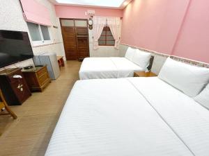 Krevet ili kreveti u jedinici u okviru objekta Yi-Shiou Home