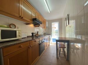 Kuchyňa alebo kuchynka v ubytovaní Apartamentos CH