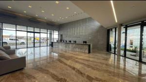 a large lobby with a reception desk in a building at Salinas premium Resort in Salinópolis