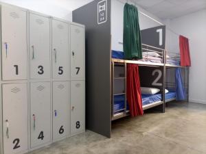 a locker room with lockers in a room at Albergue Avoa Regina in Redondela