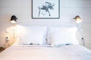 Säng eller sängar i ett rum på Villa Dakota