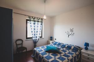 A bed or beds in a room at Agriturismo Monte della Dea