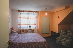 A bed or beds in a room at Agriturismo Monte della Dea