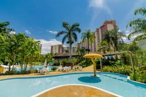 a swimming pool at a resort with a resort at HotSprings OFICIAL B3 Hotéis in Caldas Novas