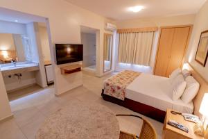 Cama ou camas em um quarto em HotSprings OFICIAL B3 Hotéis mais 18 fotos