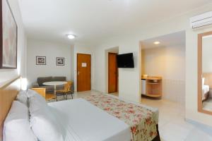 Cama ou camas em um quarto em HotSprings OFICIAL B3 Hotéis