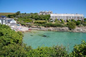 a view of a beach with people in the water at Abode Above at Tor View in Padstow