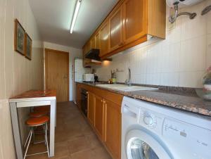 Kuchyňa alebo kuchynka v ubytovaní Apartamentos CH
