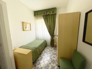 Postel nebo postele na pokoji v ubytování Hotel Reginella