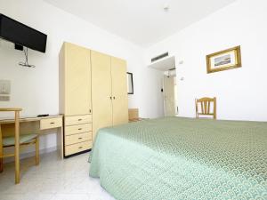 Postel nebo postele na pokoji v ubytování Hotel Reginella