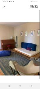 a bedroom with a large bed with blue pillows at Mas carita in Cabannes +18 photos