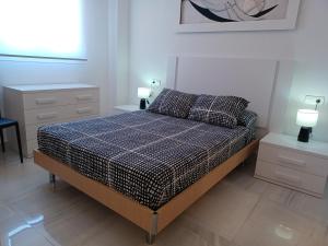 Postel nebo postele na pokoji v ubytování APCOSTAS Marina D'or 2da Línea