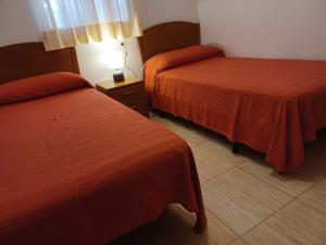 Postel nebo postele na pokoji v ubytování APCOSTAS Marina D'or 2da Línea