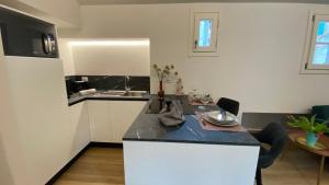 a kitchen with a counter top and a table at Sweet Dreams in Cannobio
