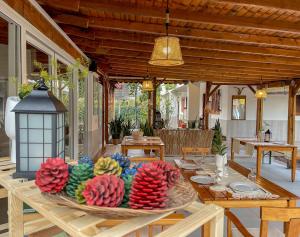 a table with colorful fruit on top of it at Oase Garden in Cıralı