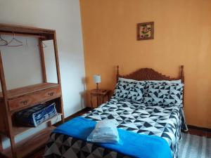Posteľ alebo postele v izbe v ubytovaní Pouso do Bizuca