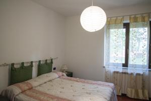 A bed or beds in a room at Agriturismo Monte della Dea