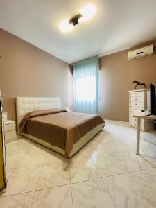 A bed or beds in a room at La casa del sole
