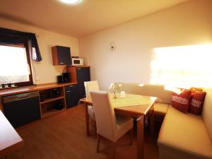 a living room with a table and a couch at Haus Emma UG in Selters