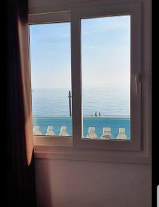 a window with a view of the ocean from a room at Hotel Doña Luisa in San Luis de Sabinillas