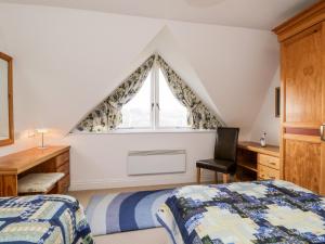 Un pat sau paturi într-o cameră la Rothay