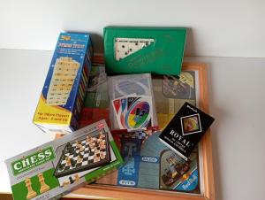 a pile of legos and games on a table at Mini Casa Barichara in Barichara