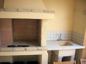 A kitchen or kitchenette at Appartamento nel cuore di Villasimius 1 piano