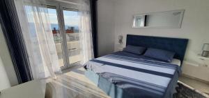 Postel nebo postele na pokoji v ubytování Apartmani Naomi&Leo