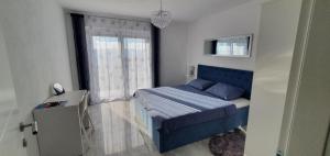 Postel nebo postele na pokoji v ubytování Apartmani Naomi&Leo