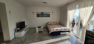 Postel nebo postele na pokoji v ubytování Apartmani Naomi&Leo
