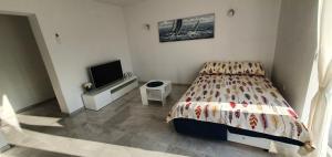 Postel nebo postele na pokoji v ubytování Apartmani Naomi&Leo