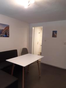 a white table in a room with two chairs at Your BaseCamp! in Roppen +22 photos