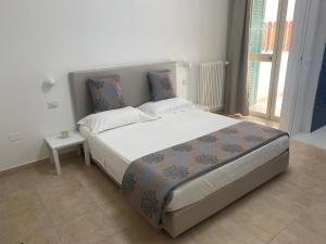 Postel nebo postele na pokoji v ubytování Casa fioRita