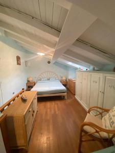 Ένα ή περισσότερα κρεβάτια σε δωμάτιο στο Casa Margherita