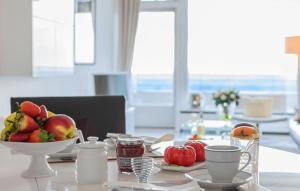 a table with a bowl of fruit on top of it at Top - Apartment mit Aussicht in Timmendorfer Strand +56 photos