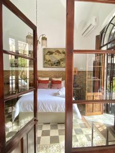 Postel nebo postele na pokoji v ubytování Casa Palacio Ánima
