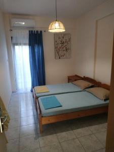 Postel nebo postele na pokoji v ubytování CHALKIDIKI NEA PLAGIA