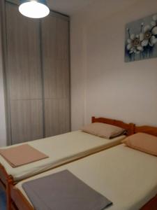 Postel nebo postele na pokoji v ubytování CHALKIDIKI NEA PLAGIA