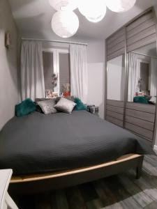 Posteľ alebo postele v izbe v ubytovaní Lux-house Braniewo