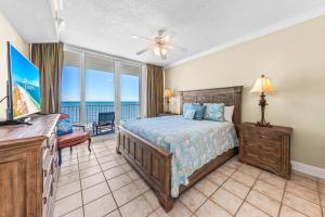 a bedroom with a bed and a view of the ocean at San Carlos Unit 607 in Gulf Shores