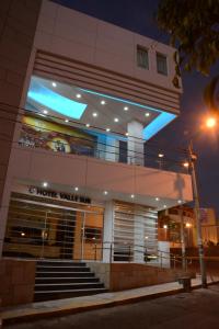 a store front of a building at night at Valle Sur Hotel Moquegua in Moquegua