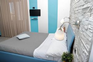 Postel nebo postele na pokoji v ubytování Guest House Le Tre Isole Sorrento