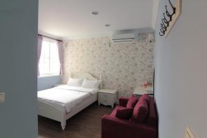 Кровать или кровати в номере Beautiful Life B&B