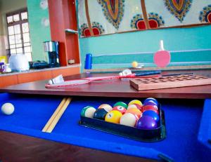 a table with a tray of balls on it at Cozy Rooms -JKIA in Syokimau