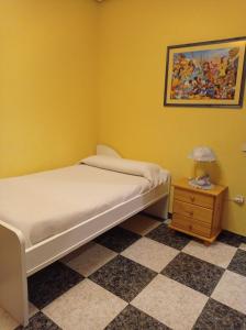 Cama o camas de una habitación en Apartamento Turístico Antigua Universidad Almagro