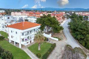 an aerial view of a white house with an orange roof at mansion luxury apartment in Psakoudia