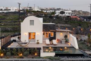 a view of a house with a pool at Saint John Oia-Villa With Private Heated Pool in Oia
