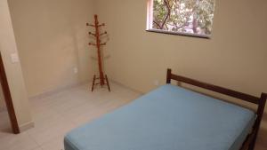 Łóżko lub łóżka w pokoju w obiekcie Praia de Setiba - Kitnet