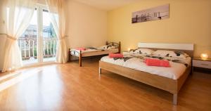 Posteľ alebo postele v izbe v ubytovaní Holiday House Jagoda